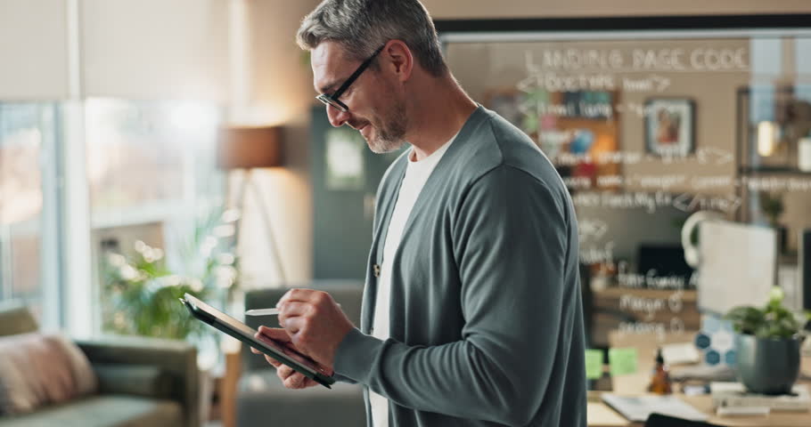 Tablet, web design and planning with business man in office for ai software as service, landing page code and ux feedback. Digital platform, app and research with mature person in tech startup