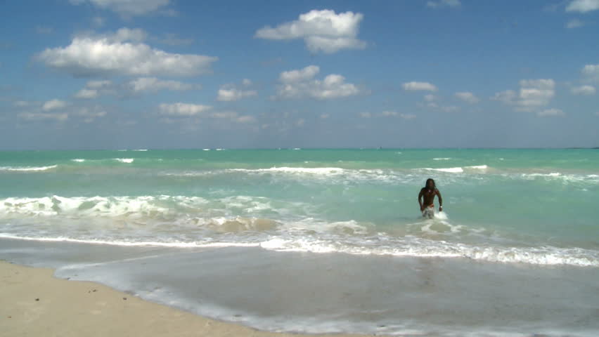 Man having fun on a beach in Cuba