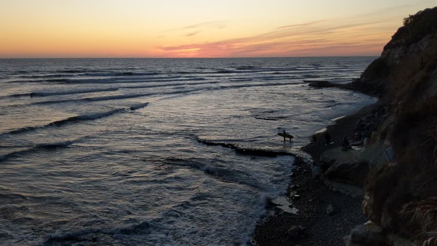 Southern California secluded coastline scenes. Waves, surfers, beaches, tide pools, palm trees, sunsets, silhouettes and rock abstractions at Swamis Reef Surf Park Encinitas Ca.