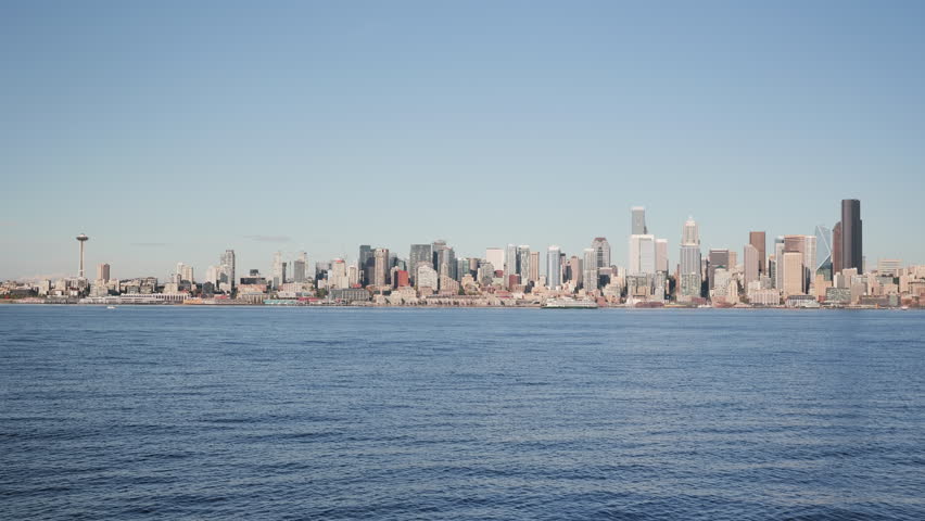 A wide view of the Seattle, Washington skyline during the day, pov across the Elliott Bay