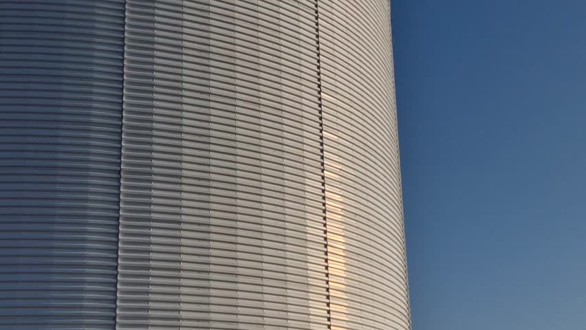 fire ladder leading to the roof of the hall. cylindrical water tank used to extinguish fires in industrial halls. operations with an increased risk of fire have their tanks for sprinkler presses
