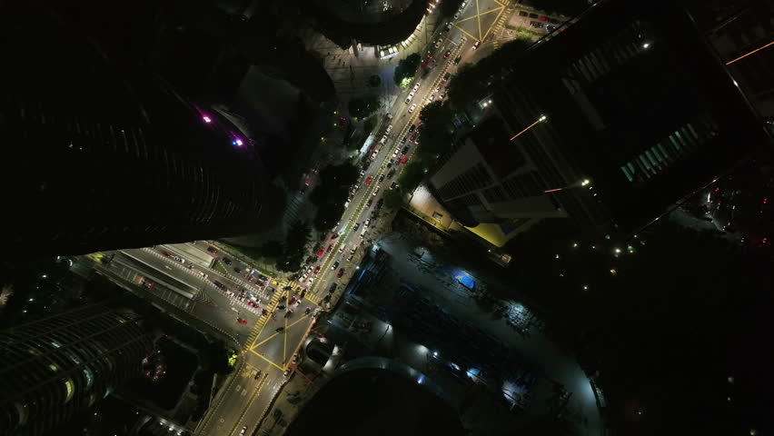 Top down drone shot of traffic on the streets of Kuala Lumpur, night in Malaysia