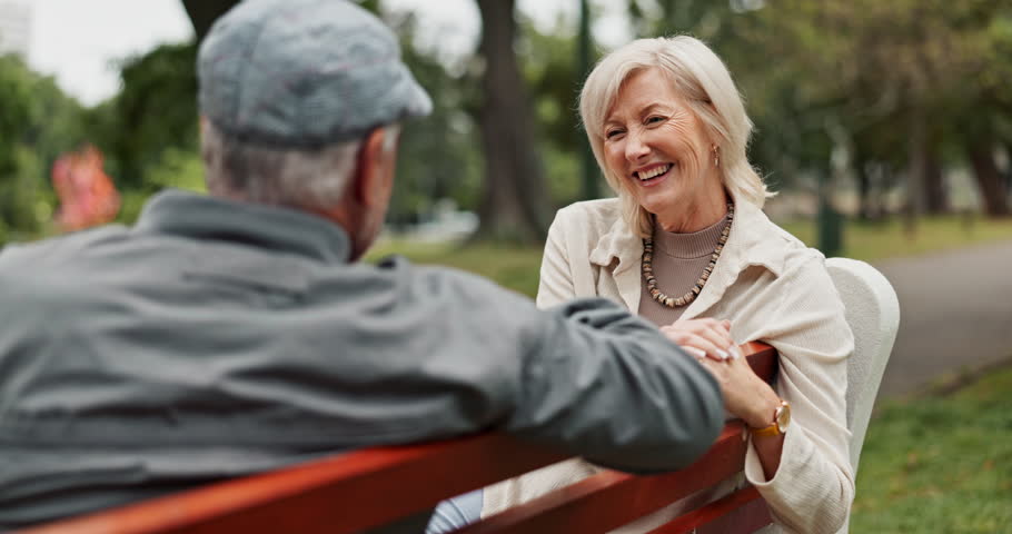 Happy, talking and mature couple in park for bonding, conversation and marriage together outdoors. Retirement, marriage and elderly man and women in nature on bench for love, care and connection