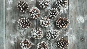 Snow-Dusted Pine Cones on Rustic Wooden Background - Powered by Shutterstock - Get 15% off with code: PIKWIZARD15