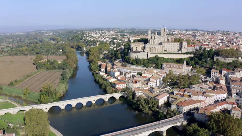 The old bridge and the Saint-Nazaire cathedral on the Orb in Béziers, Occitanie, France