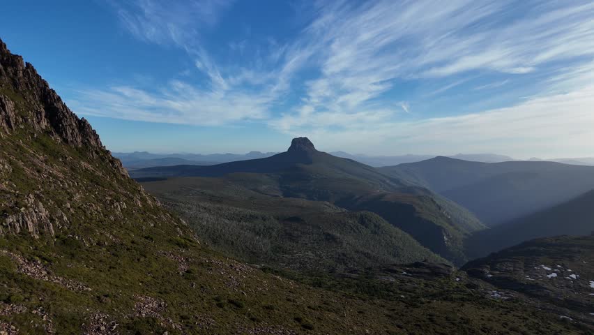 Barn Bluff Mount seen from Cradle Mountain, National Park in Central Highlands, Tasmania, Australia. Aerial forward