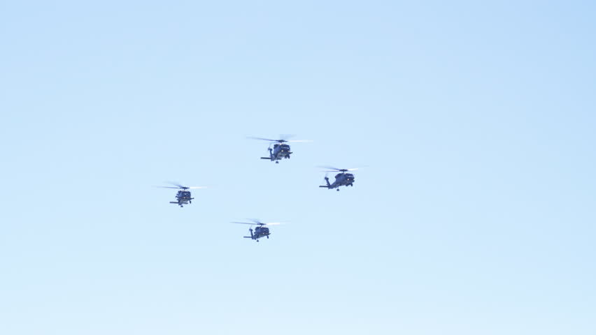Sikorsky S-70B-6 Aegean Hawk military helicopters of HAF Hellenic Air Force flying in clear blue sky, showcasing aviation and engineering excellence.