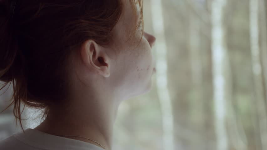 Back view of the girl. Close up girl watch on the forest