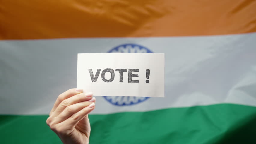 Woman Holds Title Sign With Text Vote, Indian Flag Background, General Elections 
