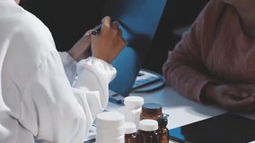 Lung disease. Doctor showing chest x-ray to her patient at table in clinic - Powered by Shutterstock - Get 15% off with code: PIKWIZARD15