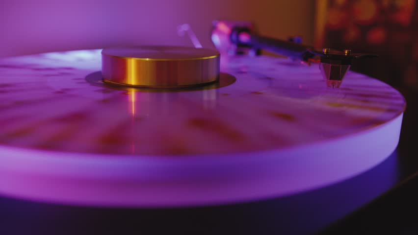 Introducing a Stylish Vinyl Record Player enhanced with Colorful Lighting Effects, perfect for creating an engaging atmosphere and delivering an enjoyable listening experience