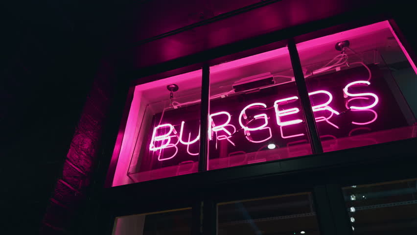 A Glowing Neon Burgers Sign Illuminates the Night A Colorful and Vibrant Fast Food Restaurant in the City