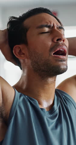 Man, sweating and tired in gym for fitness with deep breathing, burnout or endurance with workout challenge. Athlete, bodybuilder or exhausted of intense exercise with recovery, overworked or resting