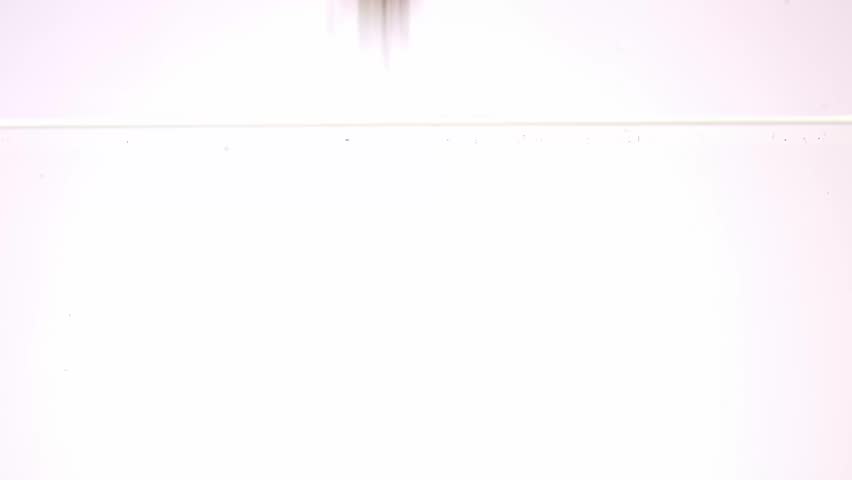 Fresh strawberries dropping into water tank 50fps slow motion