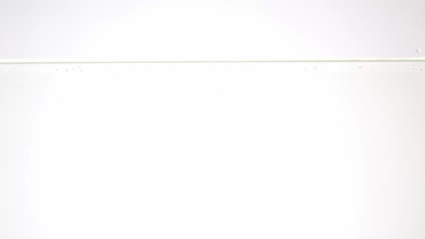 Fresh strawberries plunging into water, overcranked 120fps