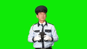 Male security guard looking around with binoculars - Green screen video for chromakey compositing - Powered by Shutterstock - Get 15% off with code: PIKWIZARD15