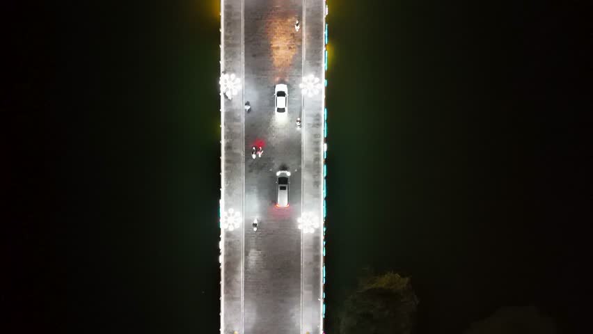 A top-down aerial view of a bridge leading to Lounan Street in Liaocheng, Shandong Province, China.
