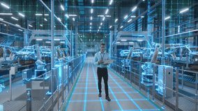 Technician Activates Futuristic Automotive Factory, Warehouse Construction of Robotic Arms and Vehicle Frames. Advanced Manufacturing Visualization Digital Twin Technology and Smart Production System - Powered by Shutterstock - Get 15% off with code: PIKWIZARD15