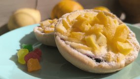Fruit and berry tartlets in close-up, dessert from a French bakery. High-quality video - Powered by Shutterstock - Get 15% off with code: PIKWIZARD15