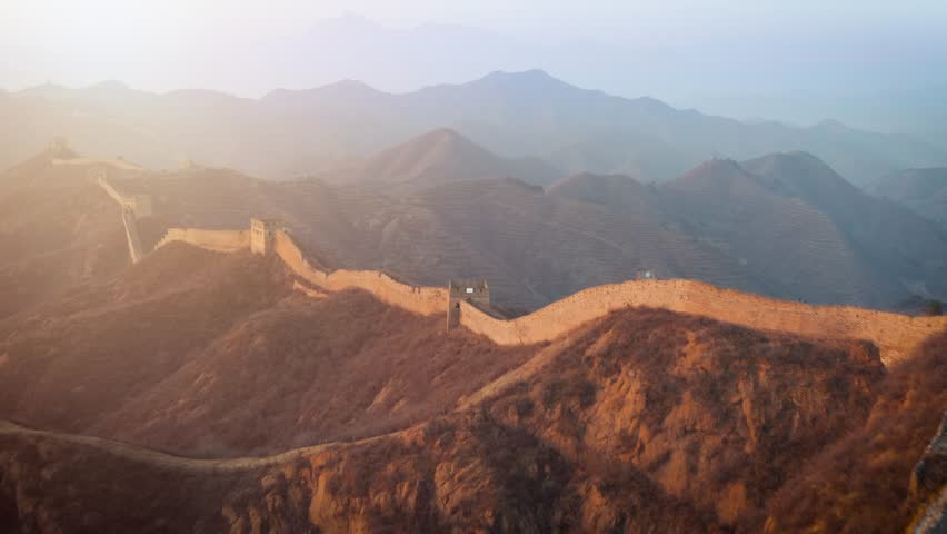 Aerial shot of the Great Wall of China at sunrise.