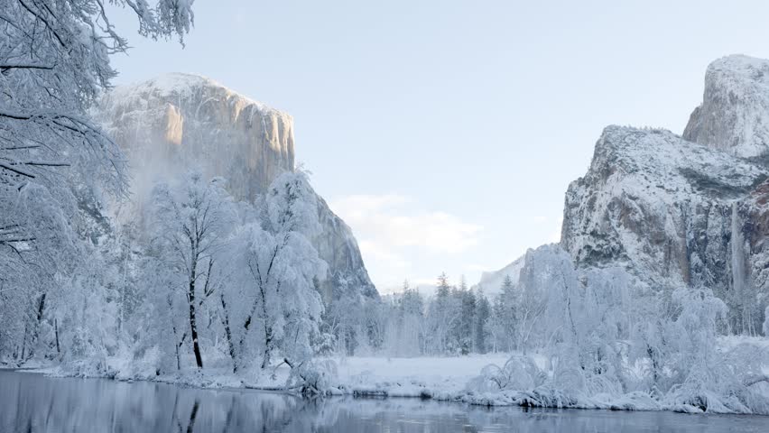 Fresh snow along the Merced River in Yosemite National Park, California. El Capitan can be seen on the left.