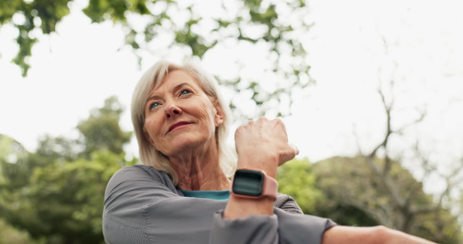 Stretching, exercise and senior woman in park for fitness, training and start for workout in nature. Retirement, happy and mature person with arms warm up for wellness, mobility and health outdoors