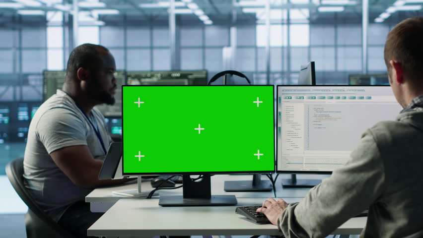Engineer in server hub using green screen PC to repair equipment storing datasets. Professional using mockup computer to do debugging on rigs doing computational operations, camera A - Powered by Shutterstock - Get 15% off with code: PIKWIZARD15