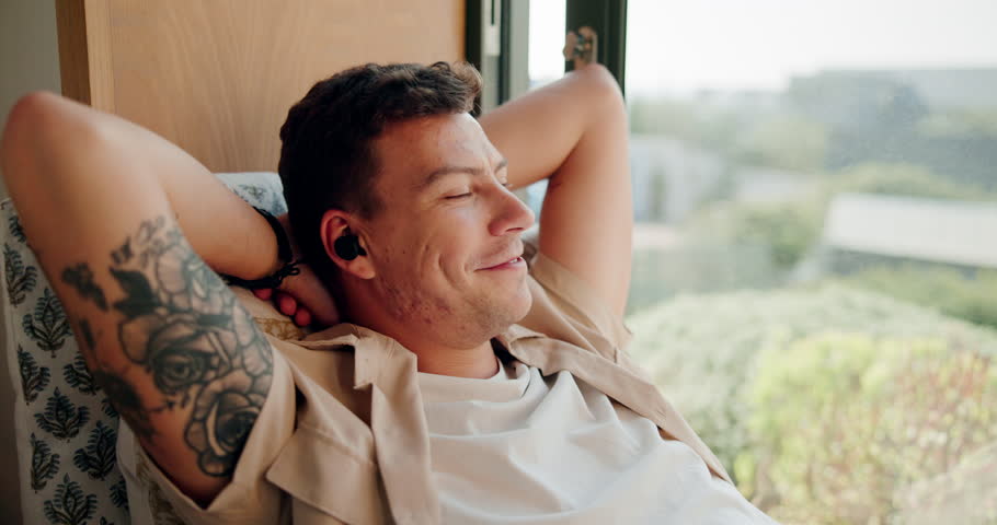 Music, relax and earphones with man and window for streaming, wellness playlist and podcast audio. Sound, technology and calm with person listening at home for happiness, mindfulness and connection