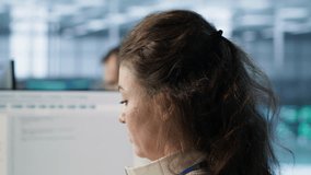 Smiling IT engineer in data center using PC to find misconfigurations affecting rackmounts. Cheerful woman checking servers bottlenecks leading to sluggish data transfer rates, camera A close up - Powered by Shutterstock - Get 15% off with code: PIKWIZARD15