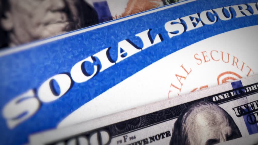Social Security card with USD currency bill, 4k footage. 100 dollars bill and social security benefit card background. USA people, rights, financial support, political.