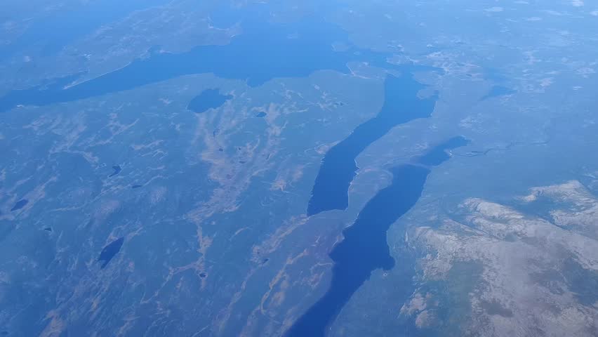 Aerial view from plane Window. Beautiful blue lakes on the Kola Peninsula, Murmansk. 