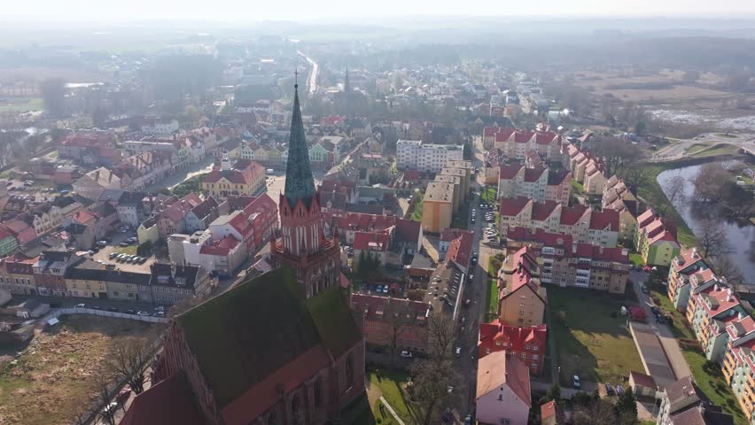 Aerial scenes of Trzebiatów capture the striking Gothic church, bustling market square, and surrounding historic streets, framing the essence of the "City of the Elephant" and its storied architecture