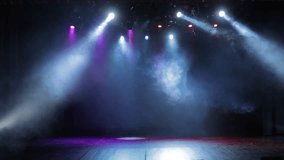 Spotlights in the concert hall. Stage light with colored spotlights and smoke. - Powered by Shutterstock - Get 15% off with code: PIKWIZARD15