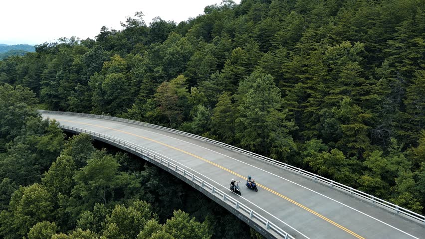 motorcycles on mountain road, drone footage