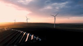 Green energy reduce carbon emissions and makes earth cleaner and more ecological.	
Solar panels park and wind turbines at sunset.Windmill turbines generating green energy electric. - Powered by Shutterstock - Get 15% off with code: PIKWIZARD15