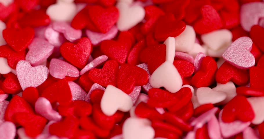 sweet sugar candies in the shape of hearts, red white and pink sugar candies for decoration