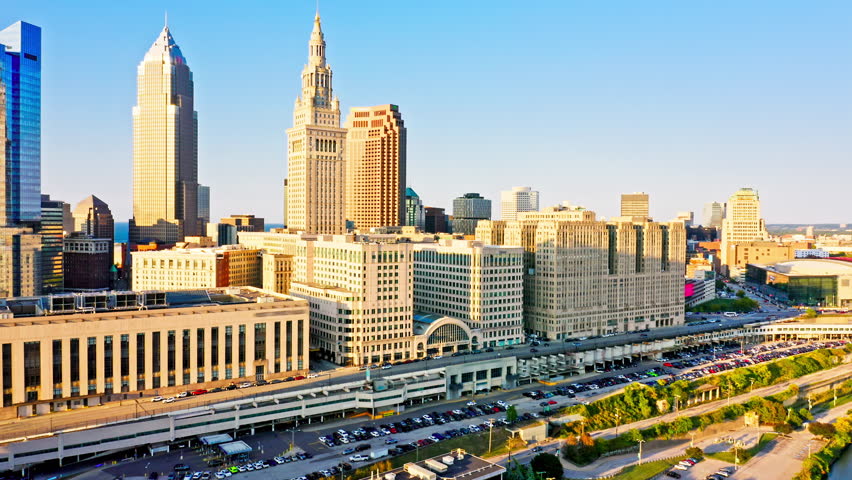 Aerial revealing shot of Cleveland, Ohio skyline at sunset. Cleveland is a major city in the U.S. state of Ohio and the county seat of Cuyahoga County.