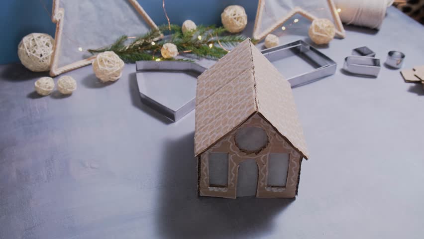 Insert garland Cardboard Lantern handmade house Storytelling creating craft Christmas holiday decoration. Tactile hand-on activity. Master class progress of creative me-made gifts. Seasonal domestic