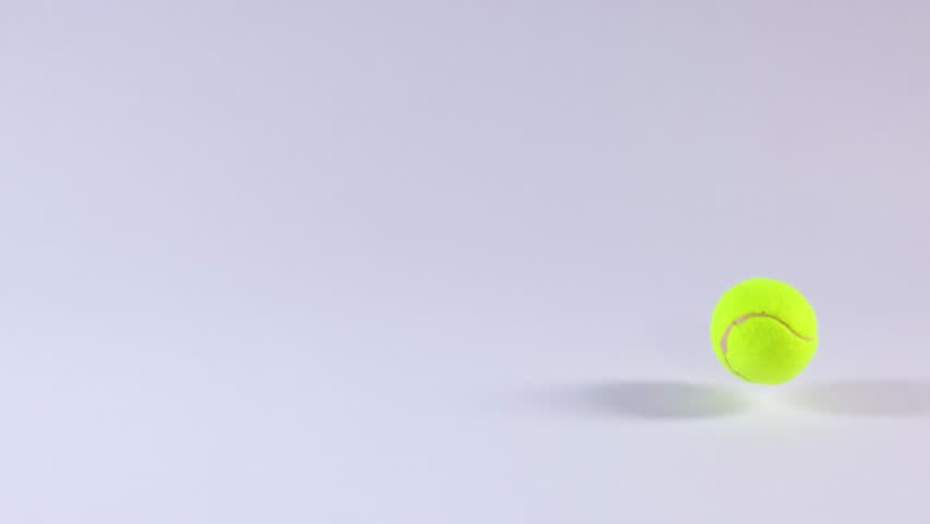 Tennis ball bouncing on a flat surface