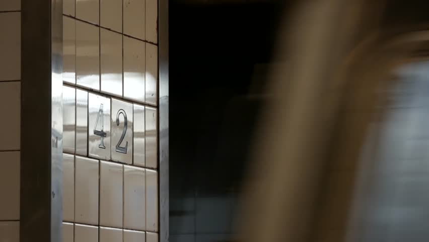 New York City subway station interior, underground metropolitan platform sign. Metro railway passenger train, public transport, United States. Text signboard 42 st. Grand Central Terminal, Manhattan.