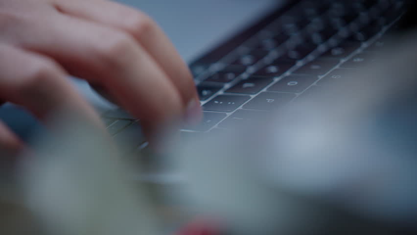 Close Up Man or Male Hands Typing on Laptop Keyboard in home office. Laptop User working online at office table or working desk. Freelancer or employee Finger writing on digital screen with laptop