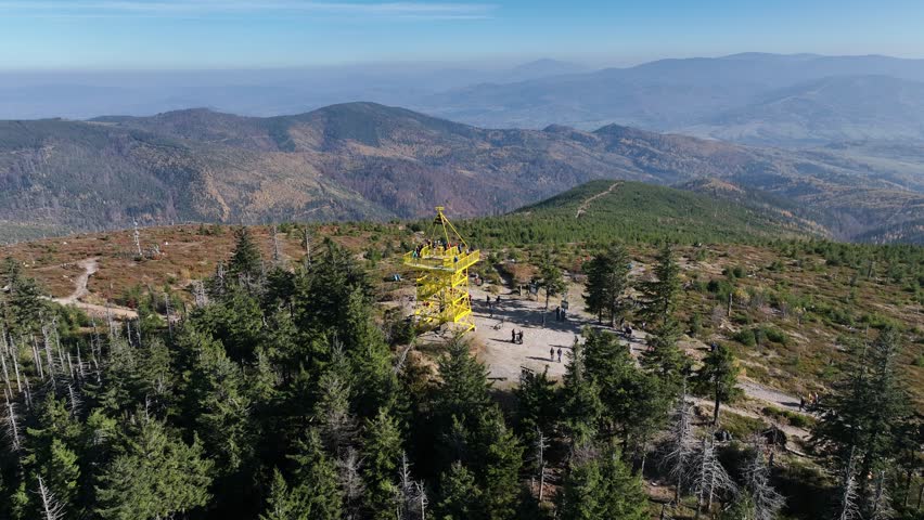 Aerial drone view of Ram Mountain.Observation tower on the top of the mountain. Autumn in the Beskid Mountains.Barania mountain domed in Silesian Beskids. Barania hill Ram Mountain nature reserve.