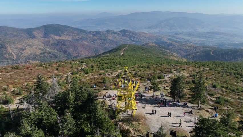 Aerial drone view of Ram Mountain.Observation tower on the top of the mountain. Autumn in the Beskid Mountains.Barania mountain domed in Silesian Beskids. Barania hill Ram Mountain nature reserve.