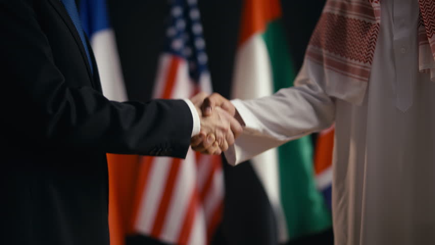 USA and UAE officials handshake after successful business negotiations, deal