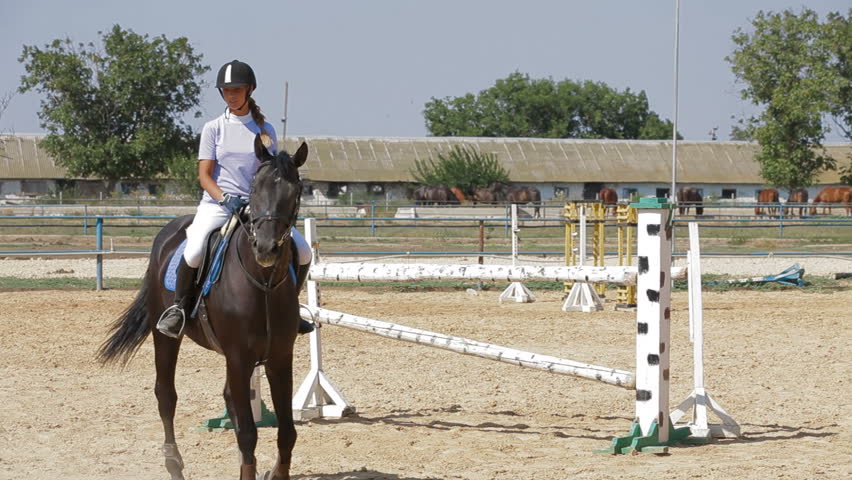 Jockey is riding horse.