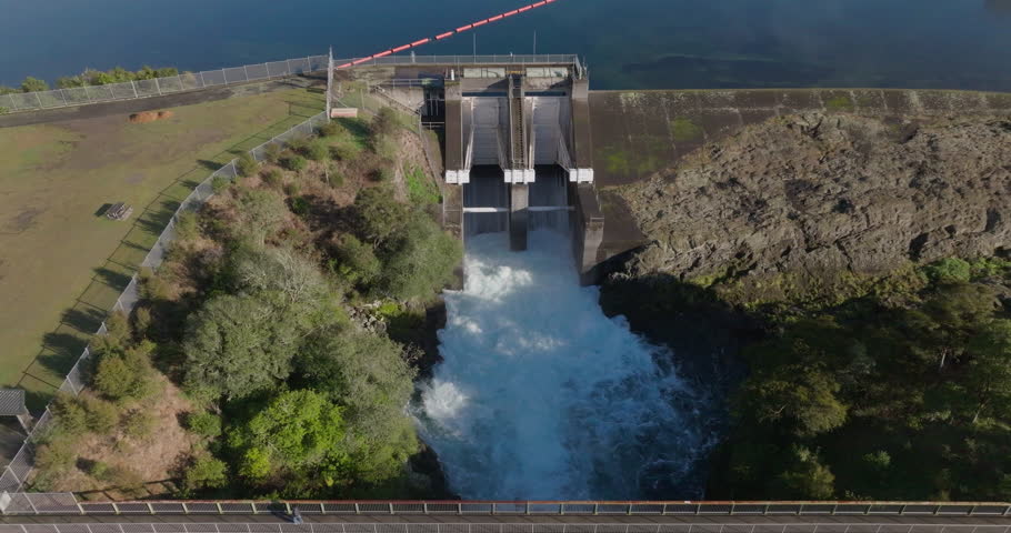 Rising drone shot of the Lake Aratiatia Dam being released. Taupo, New Zealand.