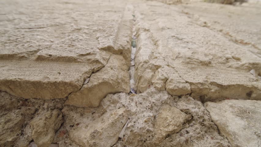 Close up Dolly in at the Notes Between the Stones of the Western Wall