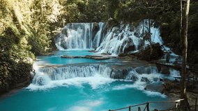 Cascade waterfalls with turquoise water in Central Sulawesi, scenic drone view - Powered by Shutterstock - Get 15% off with code: PIKWIZARD15