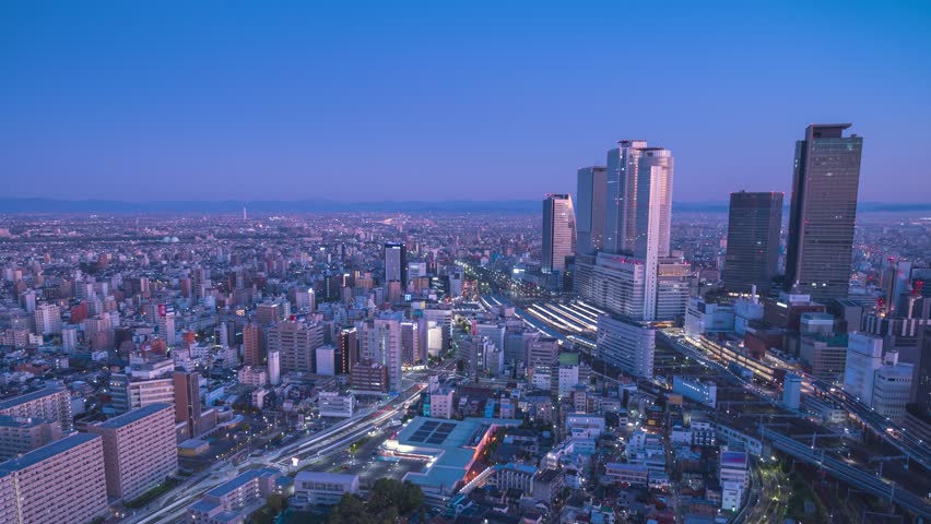 Nagoya Aichi Japan time lapse, city skyline night to day timelapse at Nagoya railway station and business center