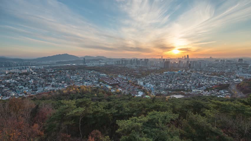 Seoul South Korea time lapse day to night sunset city skyline view from Namsan Mountain